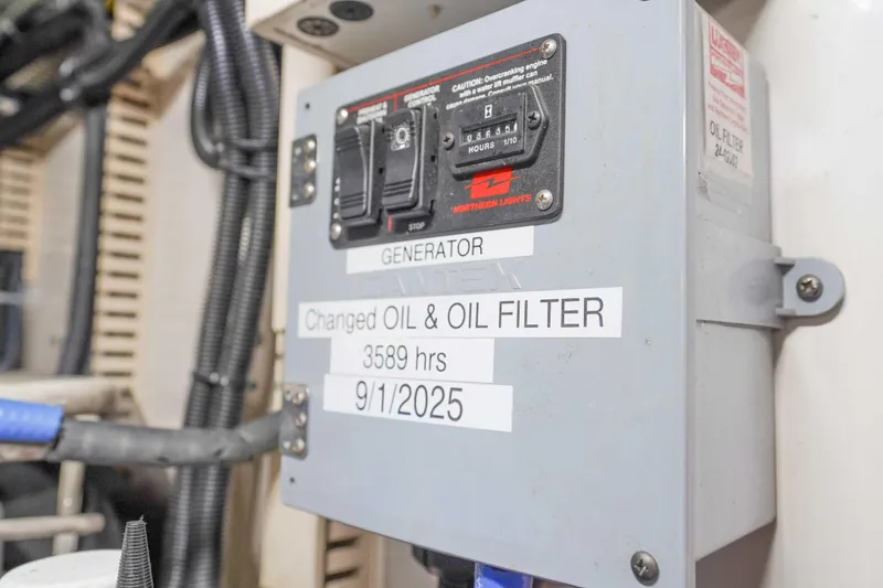 Slide: The Image of Control panel of a 1991 Viking 65 Cockpit with oil change details. - 55