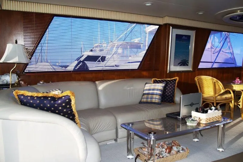 Slide: The Image of Luxurious interior of a 1991 Viking 65 Cockpit yacht with elegant seating and decor. - 6