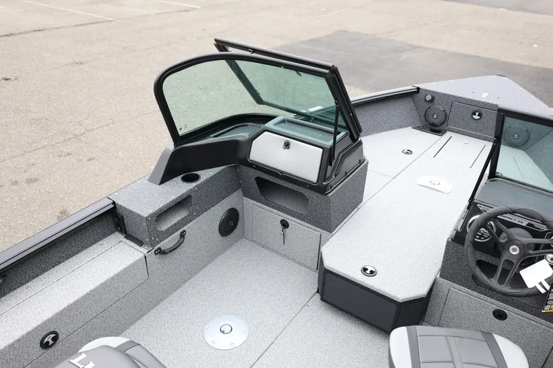 Slide: The Image of 2026 Lund 1775 Impact XS Sport boat interior with modern dashboard and seating. - 16