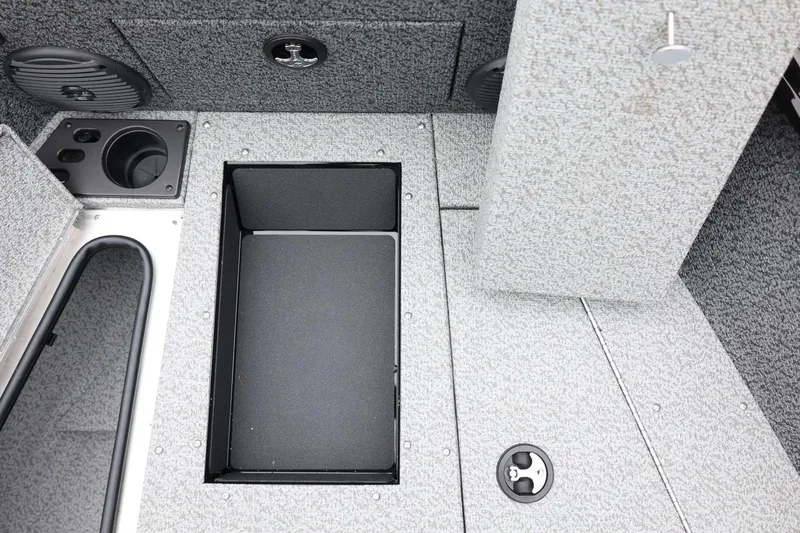 Slide: The Image of 2026 Lund 1775 Impact XS Sport boat interior storage compartments and cup holders. - 23