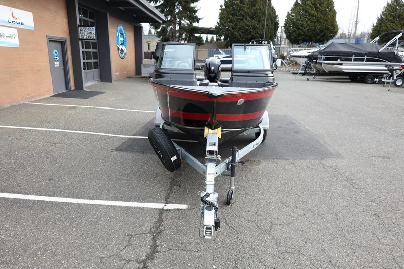 Slide: The Image of 2026 Lund 1775 Impact XS Sport boat on trailer in parking lot. - 3