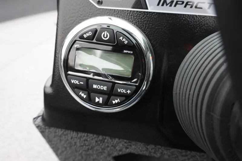 Slide: The Image of 2026 Lund 1775 Impact XS Sport boat dashboard with control panel and buttons. - 31