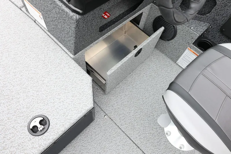 Slide: The Image of 2026 Lund 1775 Impact XS Sport boat interior with open storage compartment and seating. - 34