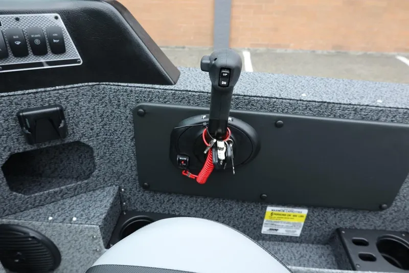 Slide: The Image of 2026 Lund 1775 Impact XS Sport boat control panel with throttle and key ignition. - 43