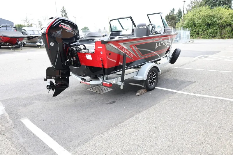 Slide: The Image of 2026 Lund 1775 Impact XS Sport boat on trailer, featuring Mercury Pro XS engine. - 6