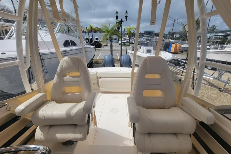Slide: The Image of 2023 Grady-White Gulfstream 232 boat interior with plush seating and modern design. - 11