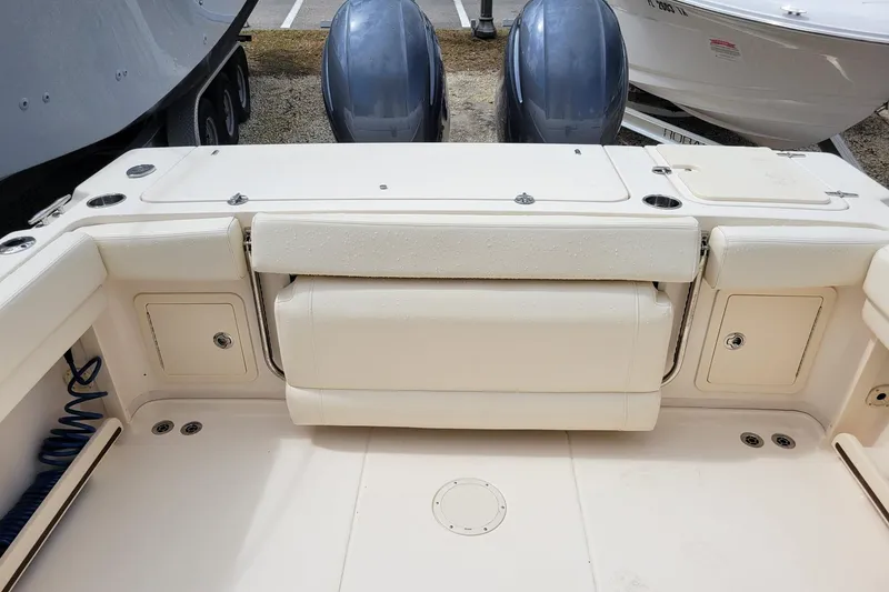 Slide: The Image of 2023 Grady-White Gulfstream 232 boat interior with seating and storage compartments. - 8