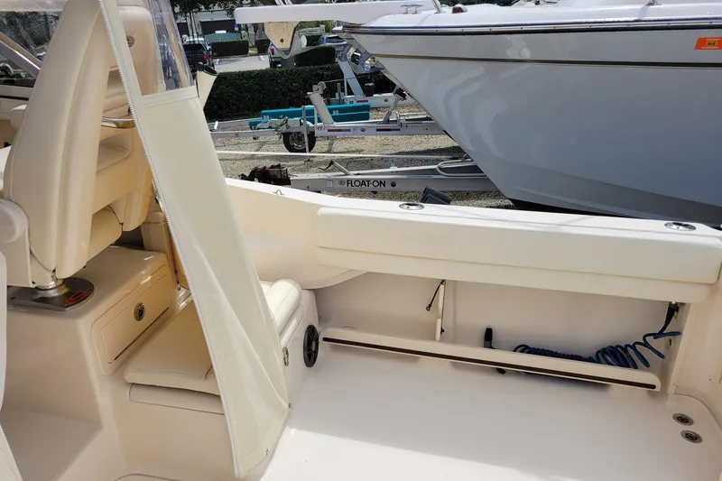 Slide: The Image of 2023 Grady-White Gulfstream 232 boat interior with seating and storage. - 9