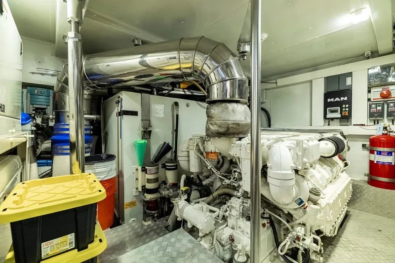 Slide: The Image of Engine room of a 2015 Azimut 80 yacht, featuring advanced machinery and equipment. - 103