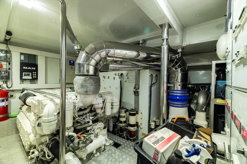 Slide: The Image of Engine room of a 2015 Azimut 80 yacht, featuring advanced machinery and equipment. - 104