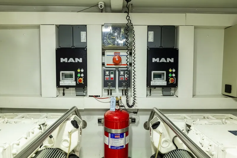 Slide: The Image of Engine room of 2015 Azimut 80 yacht with MAN control panels and fire extinguisher. - 105
