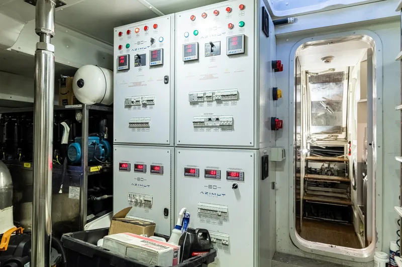 Slide: The Image of Engine room of 2015 Azimut 80 yacht with control panels and machinery. - 109