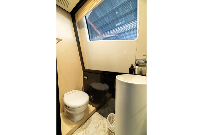 Slide: The Image of Luxurious bathroom interior of 2015 Azimut 80 yacht with modern fixtures and large window. - 18