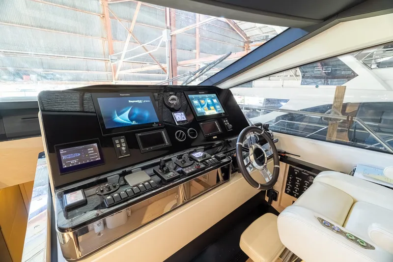 Slide: The Image of Cockpit of 2015 Azimut 80 yacht with advanced navigation controls and displays. - 24