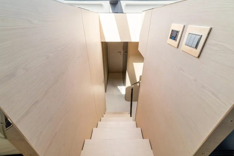 Slide: The Image of Staircase in 2015 Azimut 80 yacht with modern wood paneling and control switches. - 29