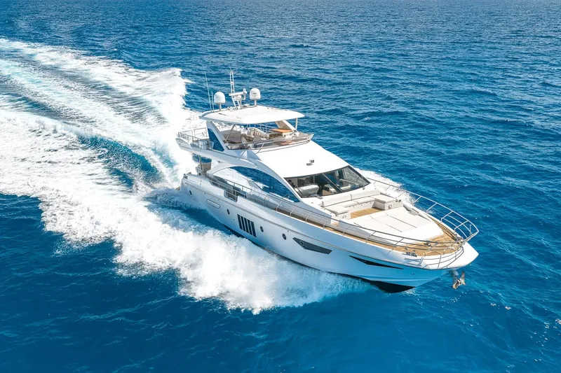 Slide: The Image of Luxurious 2015 Azimut 80 yacht cruising on clear blue ocean waters. - 3