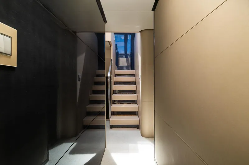 Slide: The Image of Interior staircase of 2015 Azimut 80 yacht, featuring modern design and sleek finishes. - 30