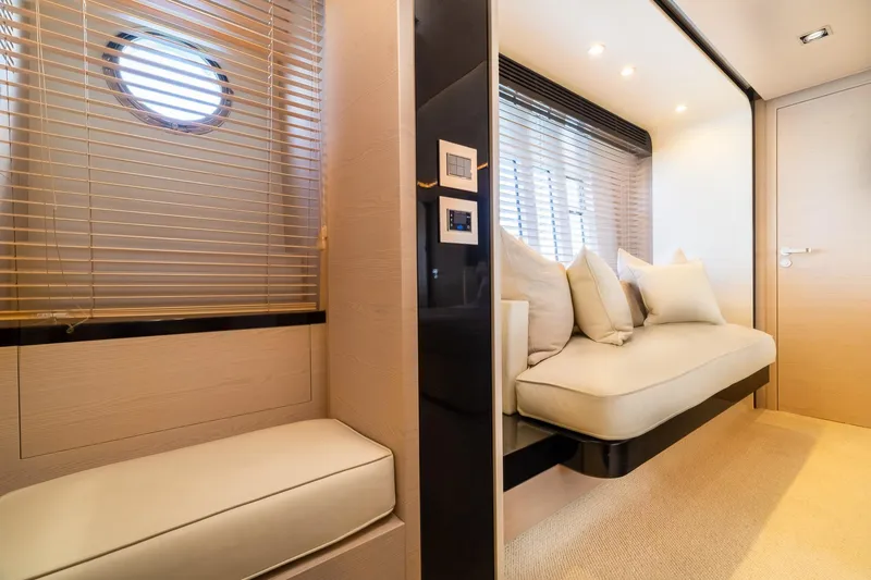 Slide: The Image of Luxurious interior of 2015 Azimut 80 yacht with elegant seating and porthole window. - 32