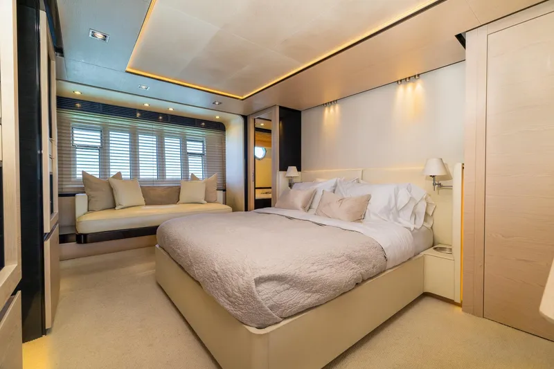 Slide: The Image of Luxurious bedroom interior on a 2015 Azimut 80 yacht, featuring elegant lighting and cozy bedding. - 34