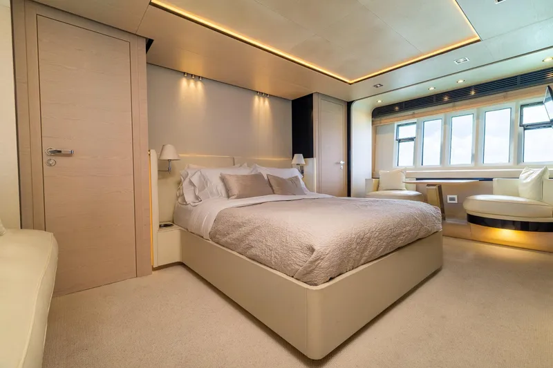 Slide: The Image of Luxurious bedroom interior on a 2015 Azimut 80 yacht, featuring modern design and elegant furnishings. - 35