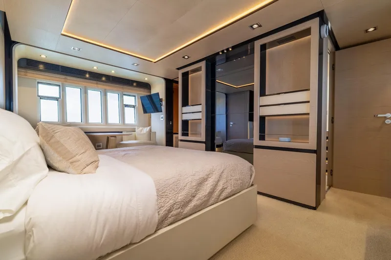 Slide: The Image of Luxurious bedroom interior on a 2015 Azimut 80 yacht, featuring modern design and elegant furnishings. - 36