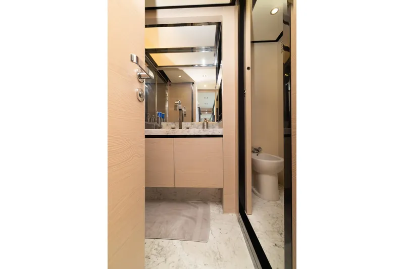 Slide: The Image of Luxurious bathroom interior on a 2015 Azimut 80 yacht, featuring marble flooring and modern fixtures. - 38