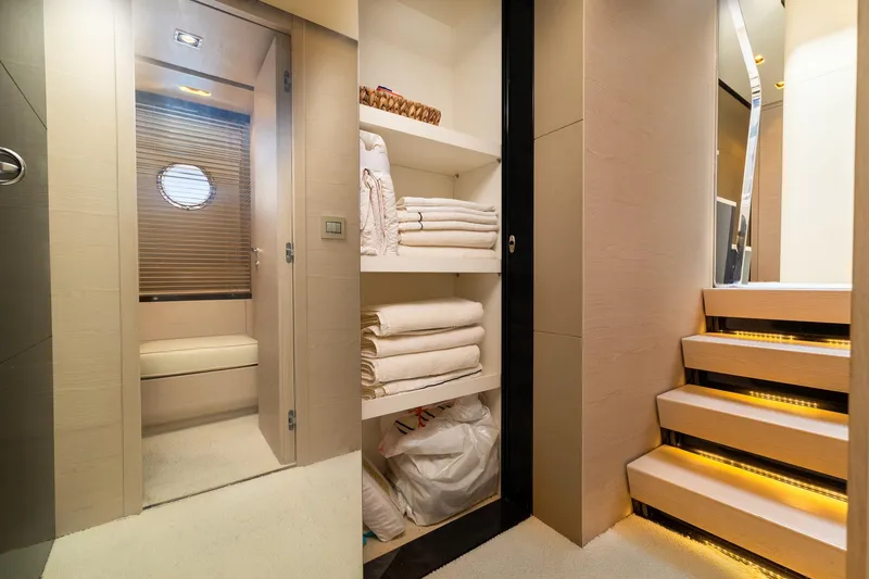 Slide: The Image of Luxurious interior of 2015 Azimut 80 yacht with elegant stairs and neatly arranged towels. - 45