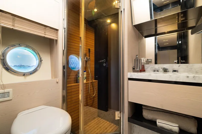 Slide: The Image of Luxurious bathroom on 2015 Azimut 80 yacht with porthole, shower, and marble sink. - 57