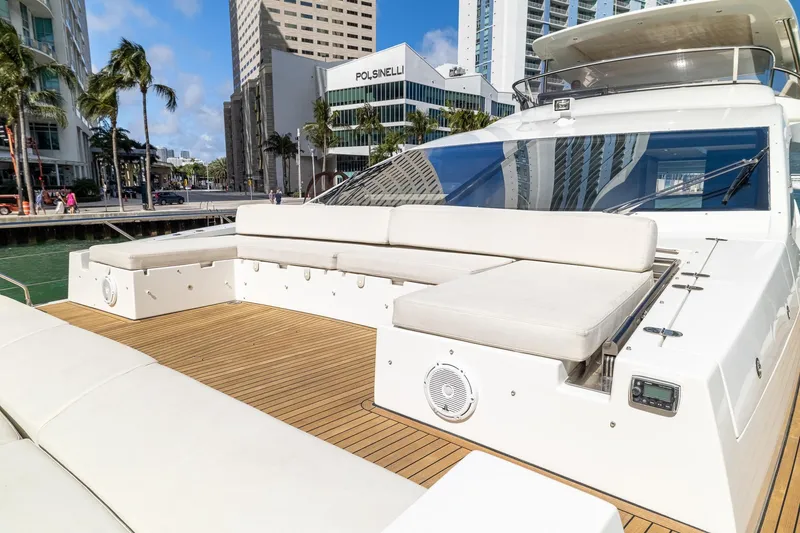Slide: The Image of Luxurious 2015 Azimut 80 yacht with spacious deck and cityscape backdrop. - 61