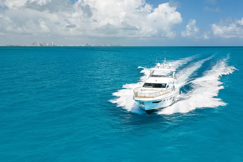 Slide: The Image of Luxurious 2015 Azimut 80 yacht cruising on vibrant blue ocean waters. - 66