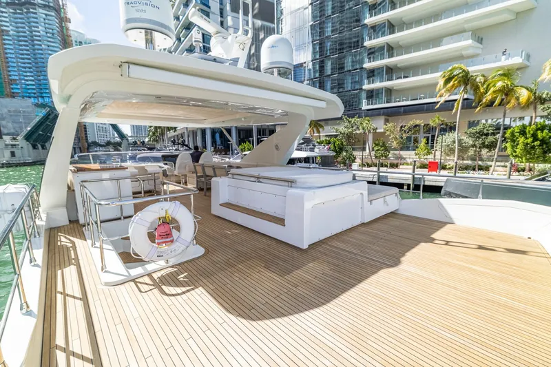 Slide: The Image of Luxurious 2015 Azimut 80 yacht deck with modern seating and waterfront view. - 69