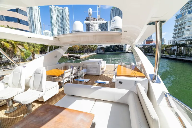 Slide: The Image of Luxurious 2015 Azimut 80 yacht deck with modern seating, city skyline view. - 71
