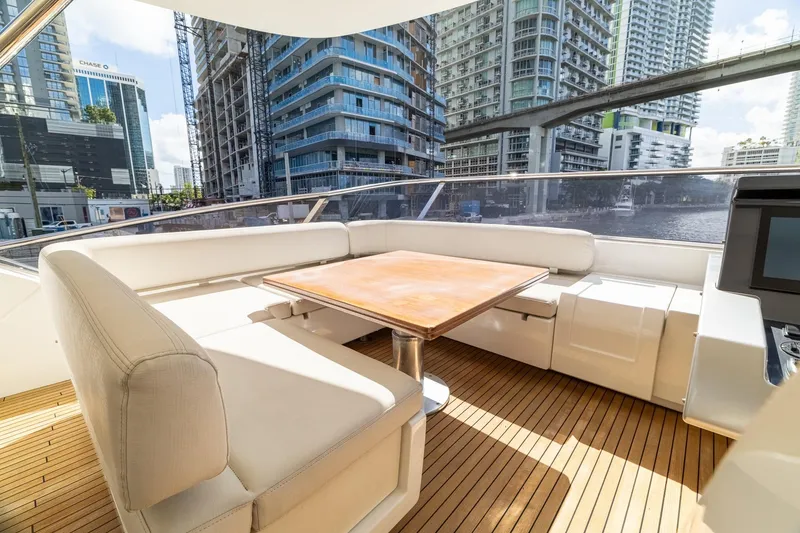 Slide: The Image of Luxurious 2015 Azimut 80 yacht deck with elegant seating and cityscape view. - 73