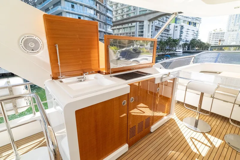 Slide: The Image of Luxurious 2015 Azimut 80 yacht deck with outdoor kitchen and seating area. - 74