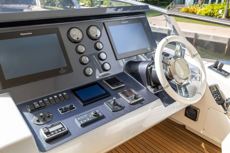 Slide: The Image of Control panel of a 2015 Azimut 80 yacht with modern navigation equipment. - 79