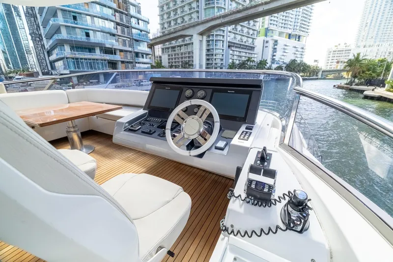 Slide: The Image of Luxurious 2015 Azimut 80 yacht helm with modern controls and waterfront city view. - 80