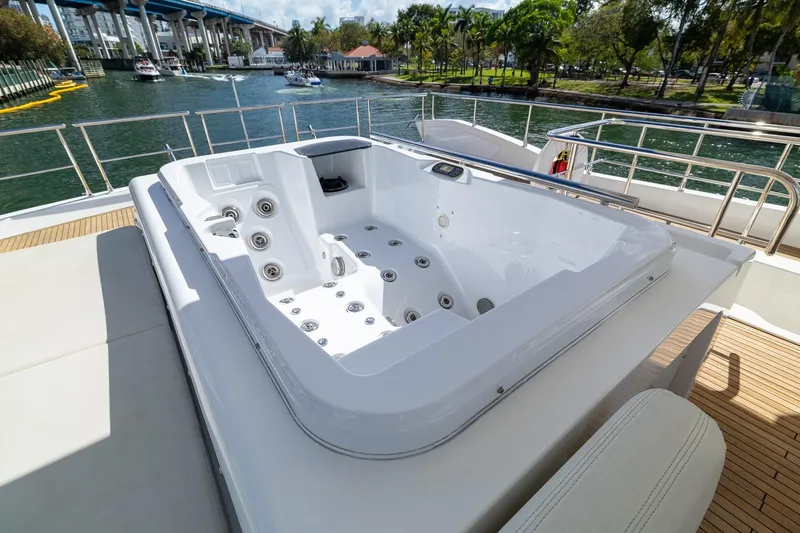 Slide: The Image of Luxurious jacuzzi on 2015 Azimut 80 yacht, docked by a scenic waterfront. - 82