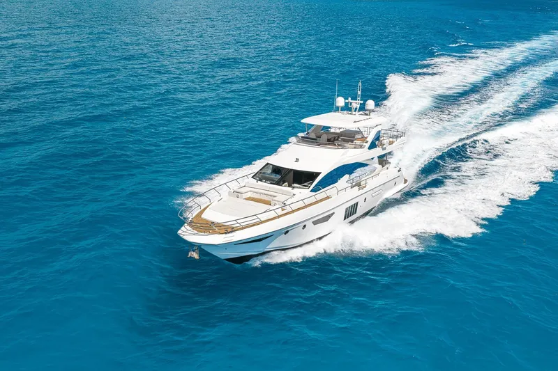 Slide: The Image of Luxurious 2015 Azimut 80 yacht cruising on vibrant blue ocean waters. - 87