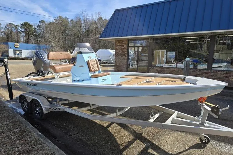 Slide: The Image of 2026 Avid 21 FSX boat on trailer outside dealership. - 12