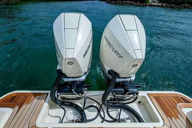 Slide: The Image of 2019 Chris-Craft Catalina 30 with dual Mercury outboard engines on water. - 10