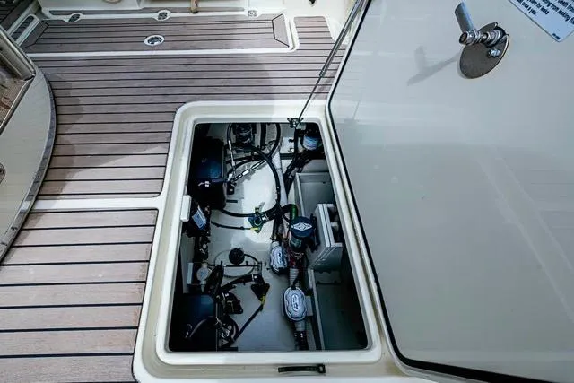 Slide: The Image of 2019 Chris-Craft Catalina 30 engine compartment with open hatch, showcasing mechanical components. - 15