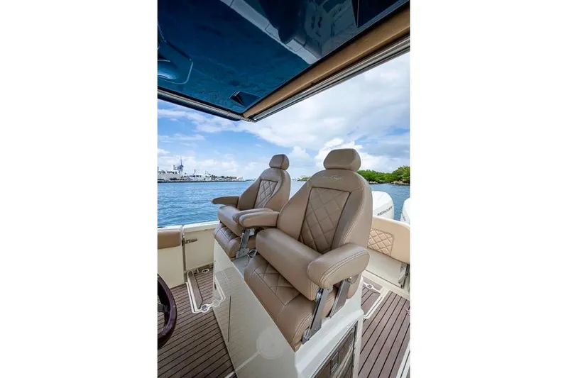 Slide: The Image of Luxurious seating on 2019 Chris-Craft Catalina 30 boat, featuring elegant design and waterfront view. - 17