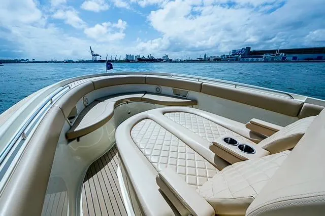 Slide: The Image of 2019 Chris-Craft Catalina 30 boat interior with luxurious seating on open water. - 28