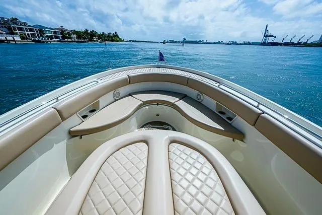 Slide: The Image of 2019 Chris-Craft Catalina 30 boat with luxurious seating, cruising on a sunny day. - 29