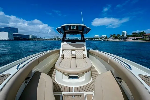 Slide: The Image of 2019 Chris-Craft Catalina 30 boat on water, featuring luxurious seating and modern design. - 30