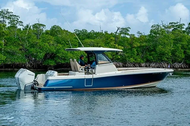 Slide: The Image of 2019 Chris-Craft Catalina 30 boat cruising near lush mangroves. - 39