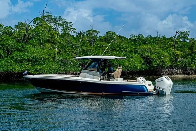 Slide: The Image of 2019 Chris-Craft Catalina 30 boat on calm water near lush green mangroves. - 41