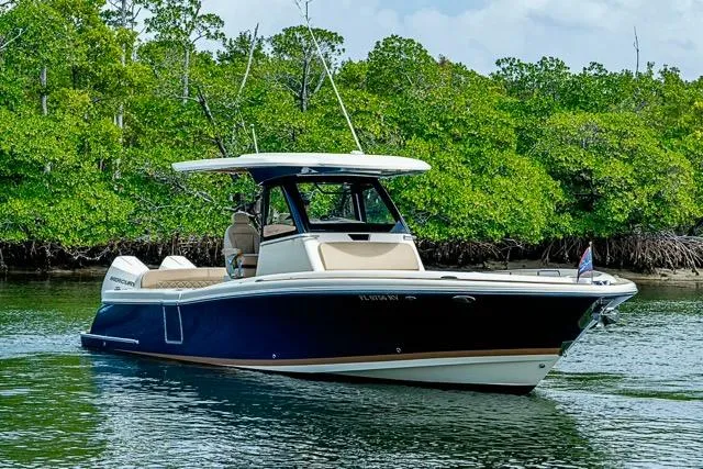Slide: The Image of 2019 Chris-Craft Catalina 30 boat cruising near lush green mangroves. - 42