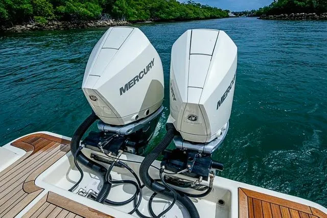 Slide: The Image of 2019 Chris-Craft Catalina 30 with twin Mercury outboard engines on a scenic waterway. - 8