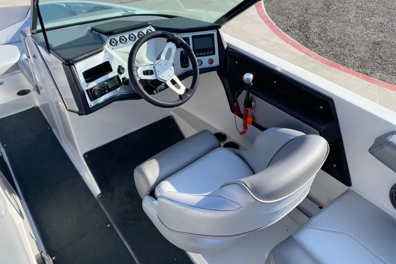 Slide: The Image of 2017 MASTERCRFAT NXT 20 boat interior with steering wheel and captain's seat. - 11